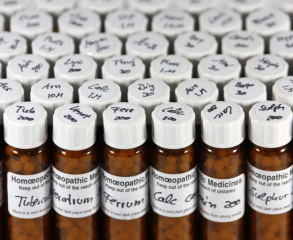 Amber screw head vials with Homoeopathic medicine inside