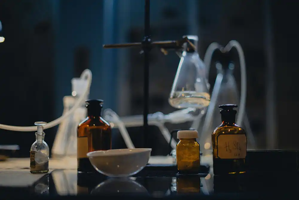 A selection of small glass bottles in a laboratory.