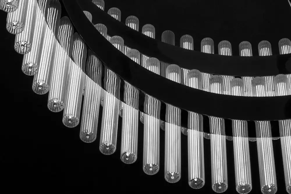 Several glass tubes being manufactured.