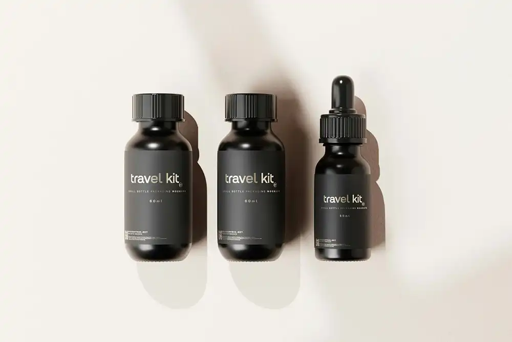 A set of three black glass dropper bottles with sleek custom labels.