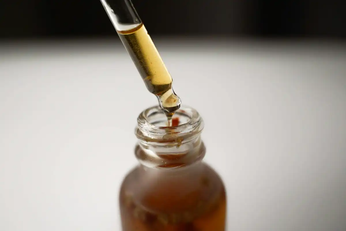 A dropper bottle filled with a thick liquid.